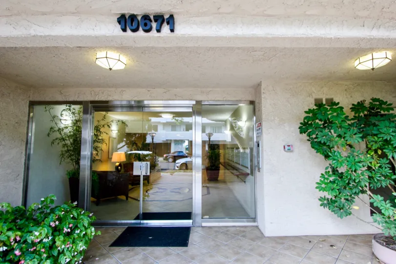 The plants and glassdoor outside 10671 Westwood Place residential community