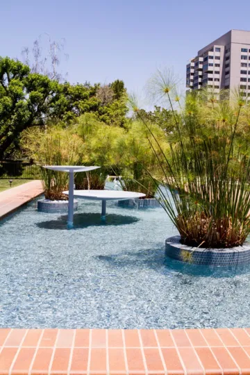 The hedges around the Villas at Kentwood building