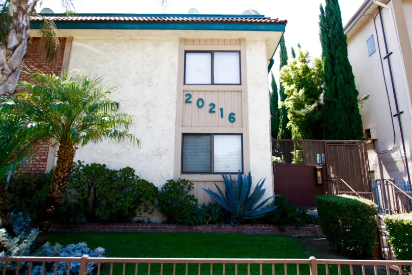 The address for Roscoe Gardens on the building