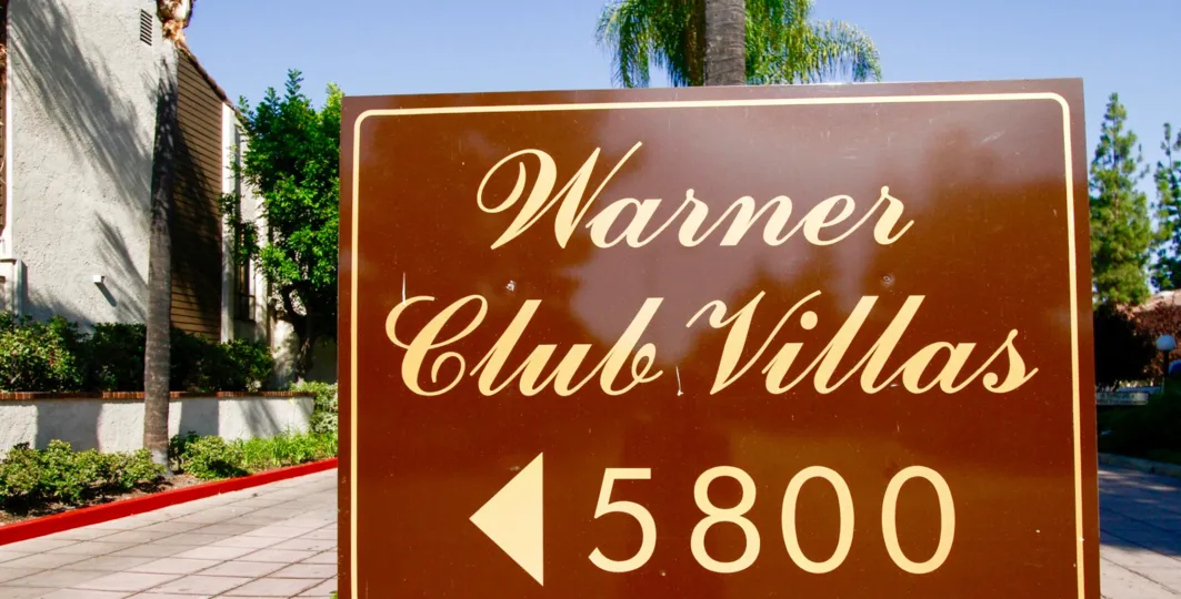 The sign into Warner Club Villas in CA California