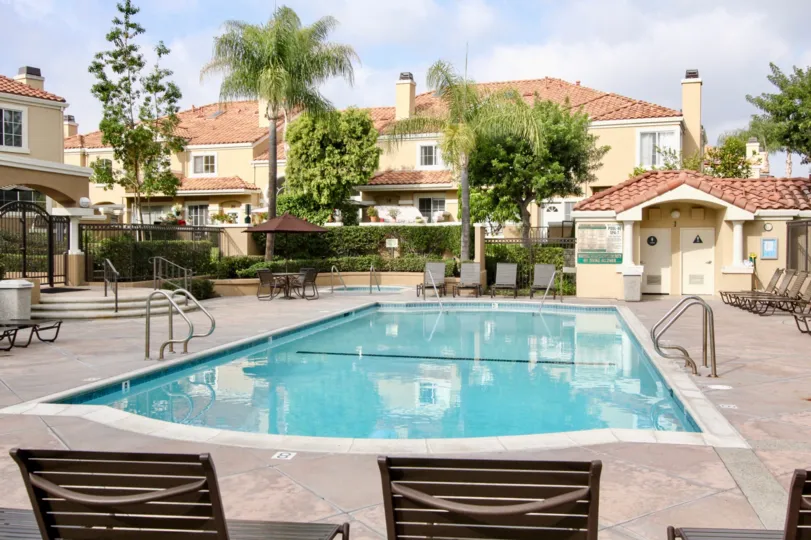 Fabulous swimming pool with trees around near villas of Applause in Aliso Viejo