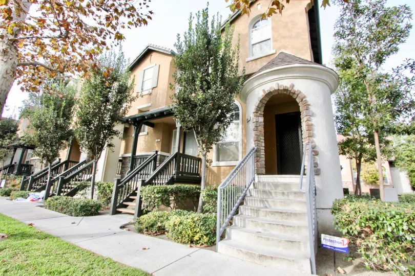 Some beautiful apartments entrance in the Camden Park with some shrubs and flowering trees.