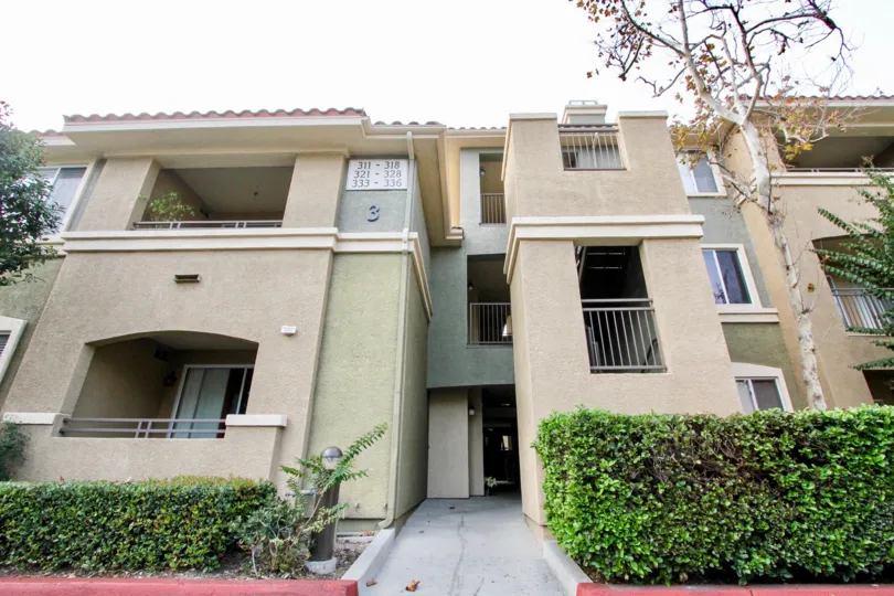 Villa with green plants at entrance with balconies in Canyon Point of Aliso Viejo