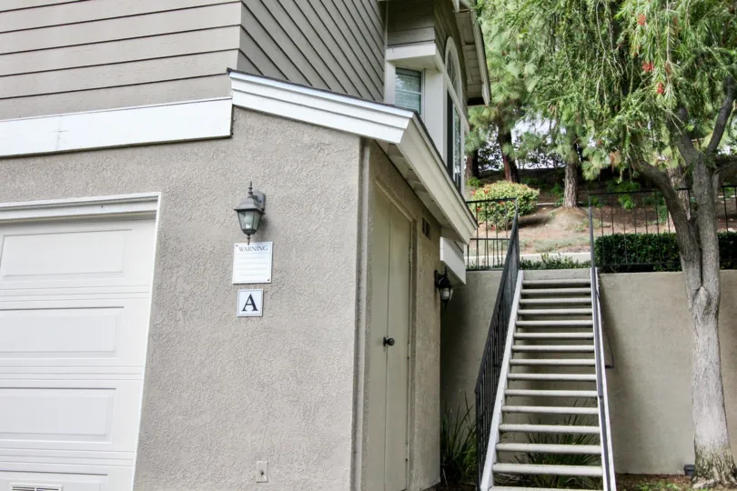 THE A. VILLAS IN THE CANYON VILLAS WITH THE STEPS, PLANTS, TREES