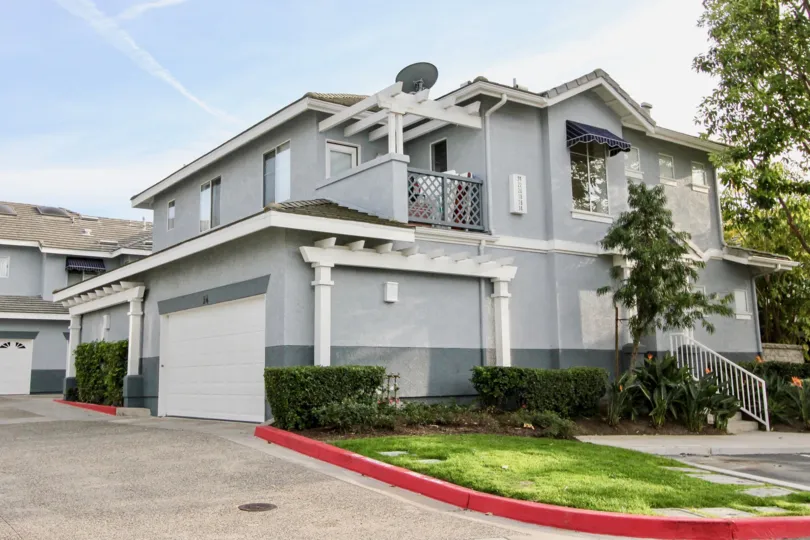 A bright day in the Coronado with a ash color house.