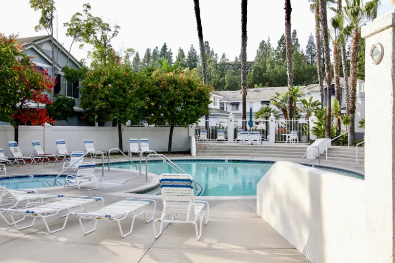 A round hot tub and spa next to juicy fruit trees inside Coronado in Aliso Viejo CA