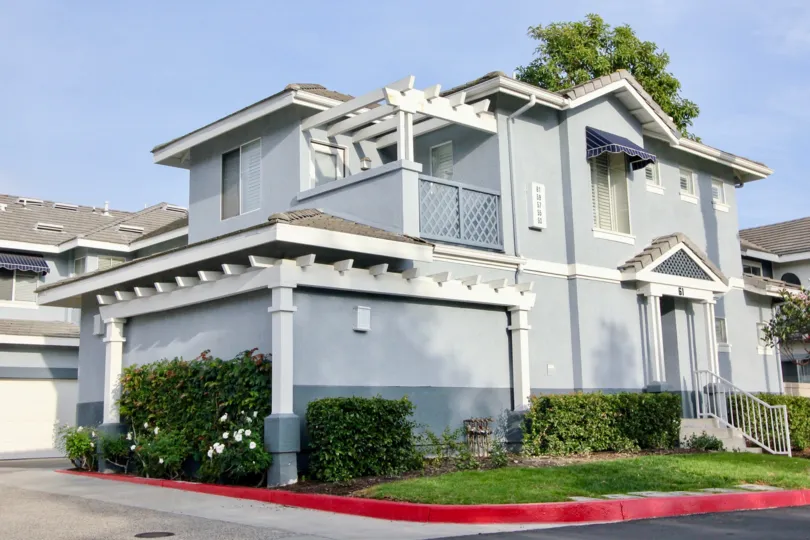 Exposed white planks and a pale blue paint job give this Coronado home a beachy vibe.