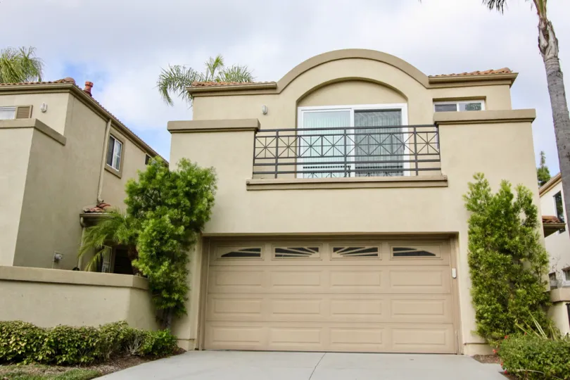 Beautiful southwestern style home in Islands community of Aliso Viejo, California, boasting a spacious second story deck above a two car garage