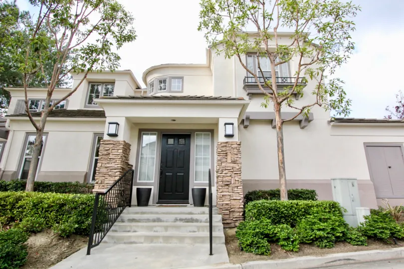 a warm day in the la mirage with house that has front of trees and lights
