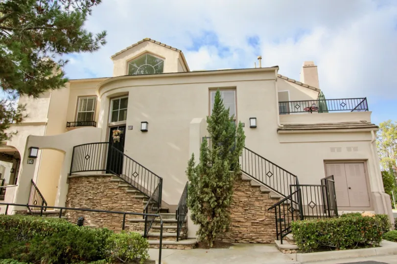 a warm day in the la mirage with house that has front of steps in garden