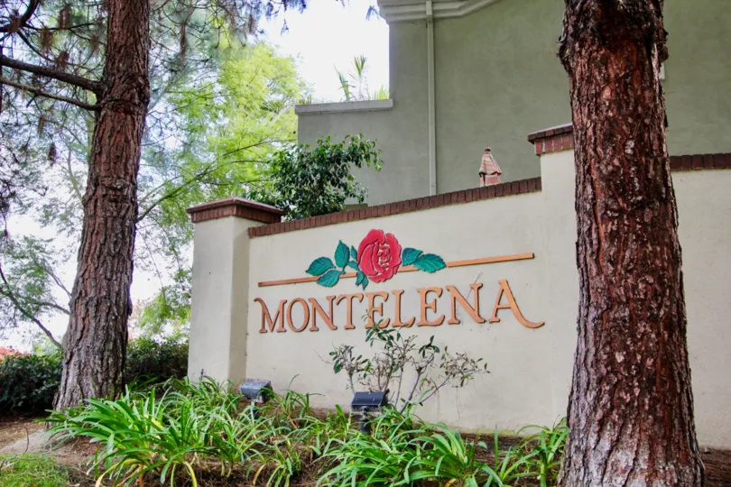 A bright day in the Montelena with a signage and trees.