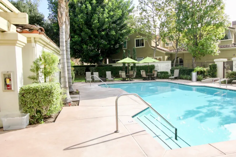 Beautiful outdoor pool with ample shady seating, located in the Montelena community of Aliso Viejo, California