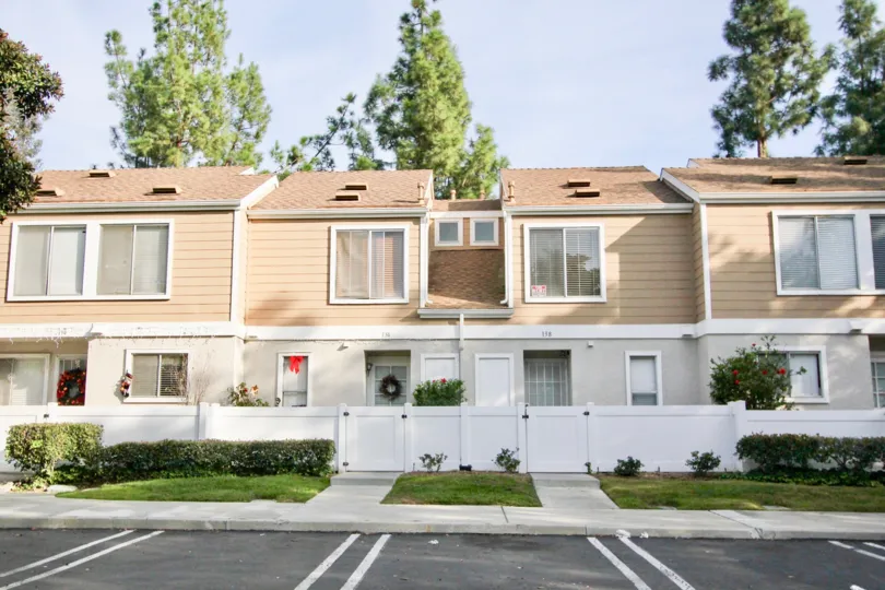 Some apartments near the road side in the Morningside with some lawn and shrubs also.