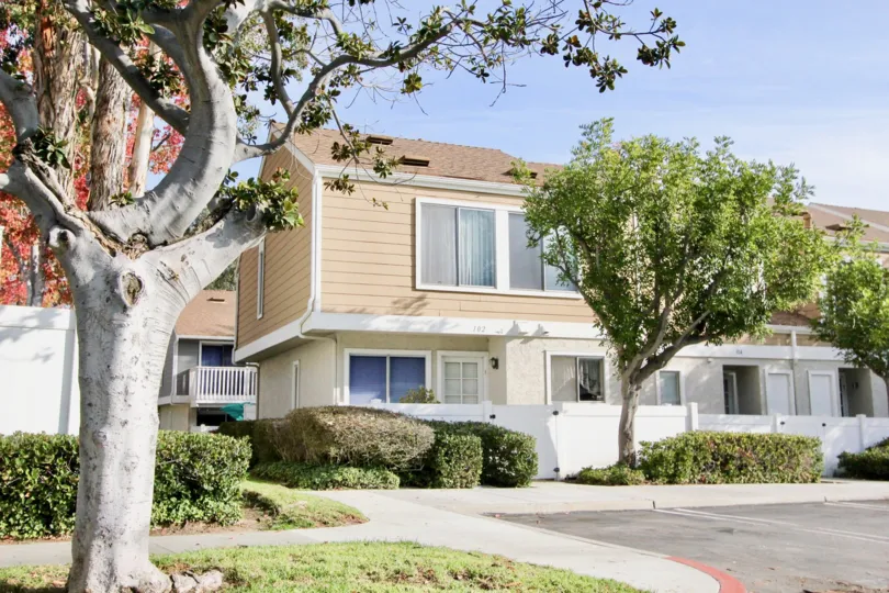 Sunny sky with Trees and bushes and apartments in the Morningside Community in Aliso Viejo, CA.