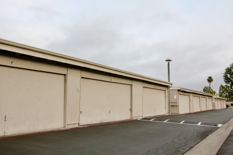 A row of storage units lined on the street of New World Condos.