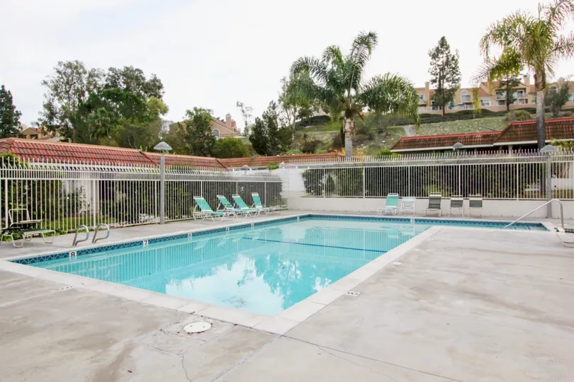 Nice swimming pool and sitout with trees around in New World Condos of Aliso Viejo