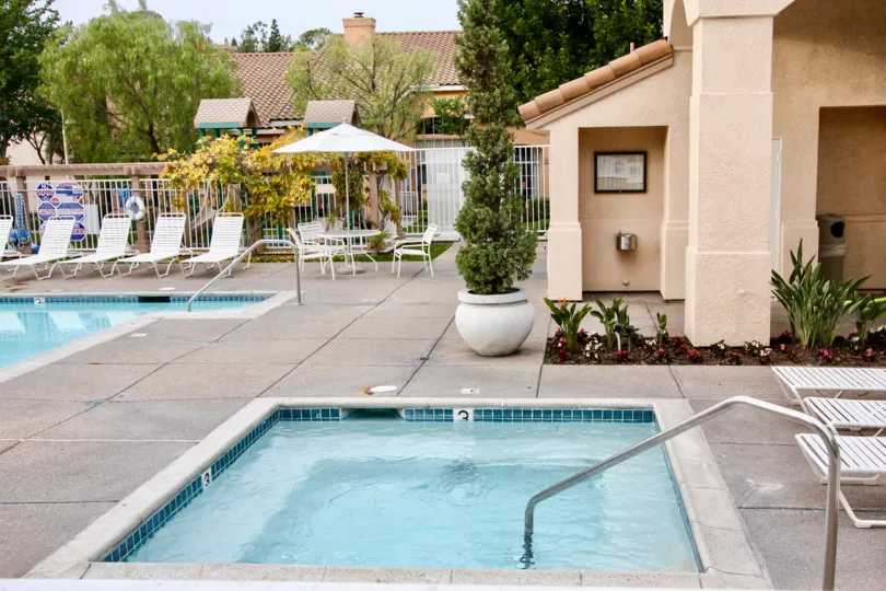 A great day in the Court with swimming pools and chairs.