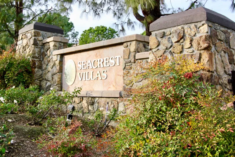 Sun lights the entry sign to the Secrest Villas of Aliso Viejo, CA