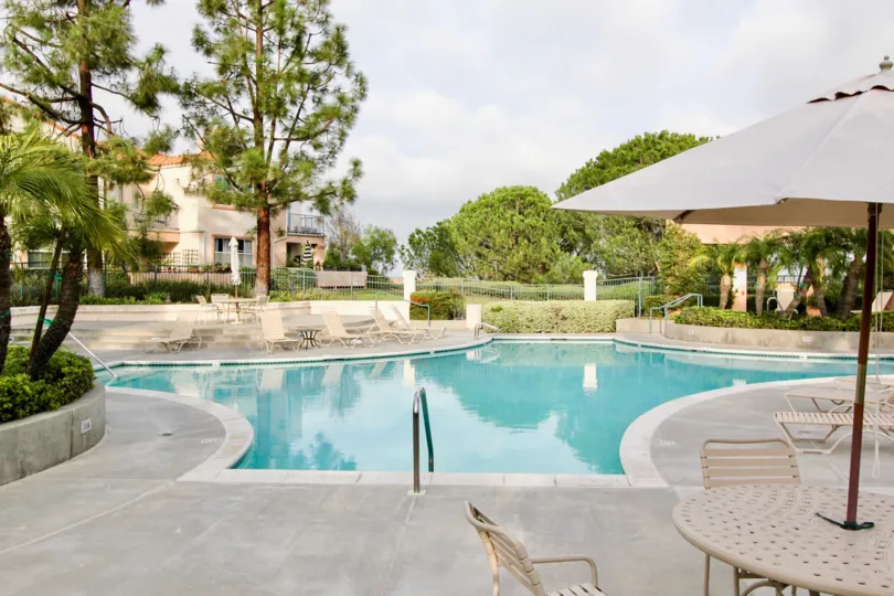 Large swimming pool with ample deck space and unobstructed views with privacy trees at Seacove Villas