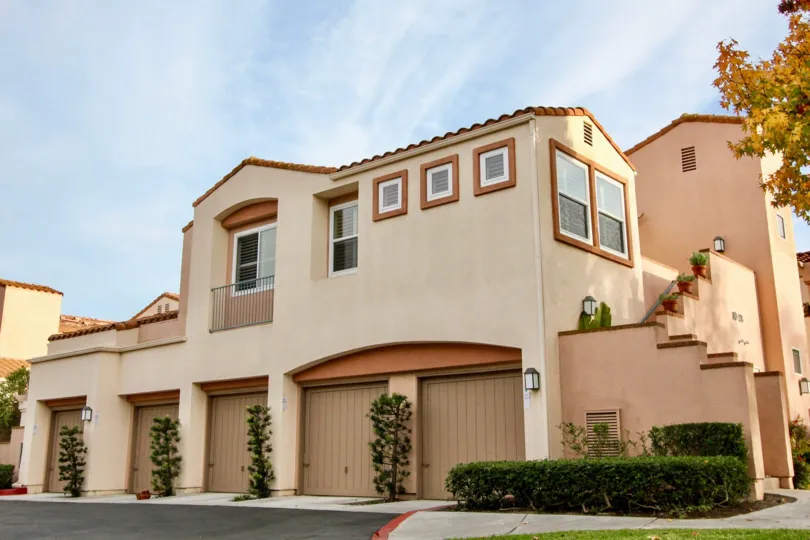 a warm day in the seacove villas with house that has glass windows on 2 and 1 storey