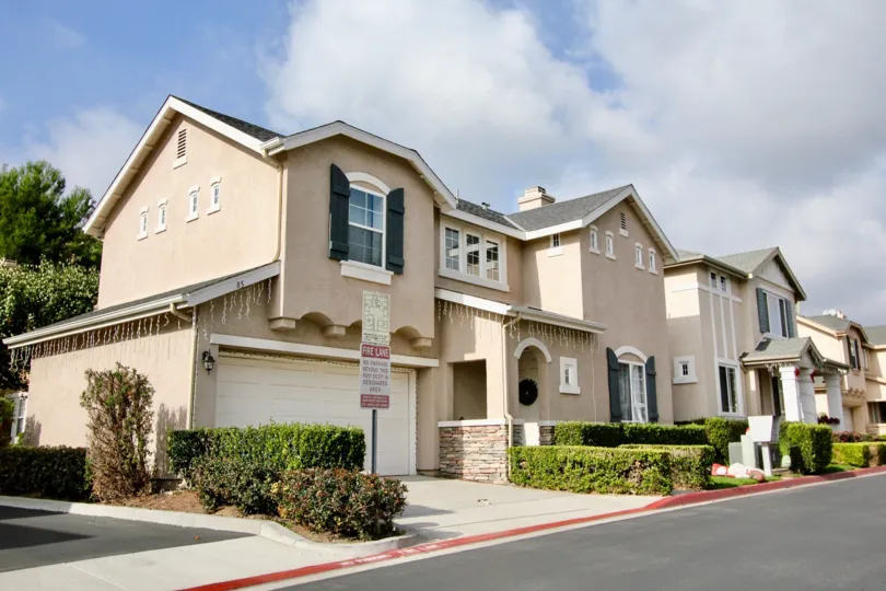 A partly cloudy day in Aliso Viejo, California with holiday decorated homes.