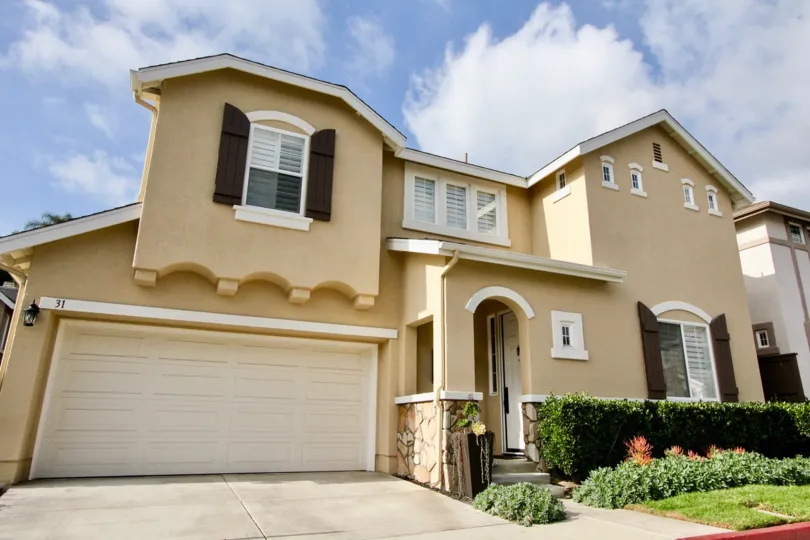 Brown shutters and curved accents make this Soleil community home stand out from the crowd.
