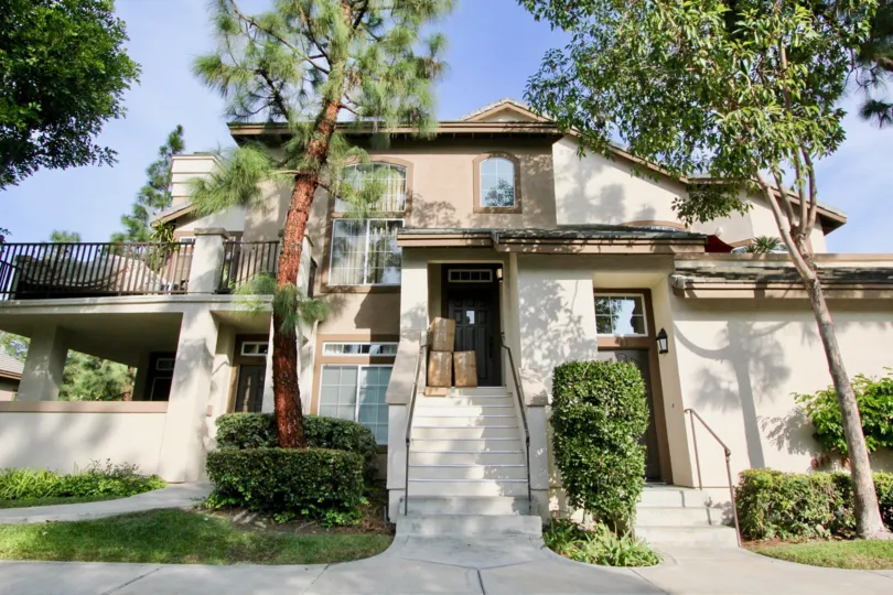 Three large packages sit outside the front door of a beautiful home in the St. Tropez community of Aliso Viejo, California