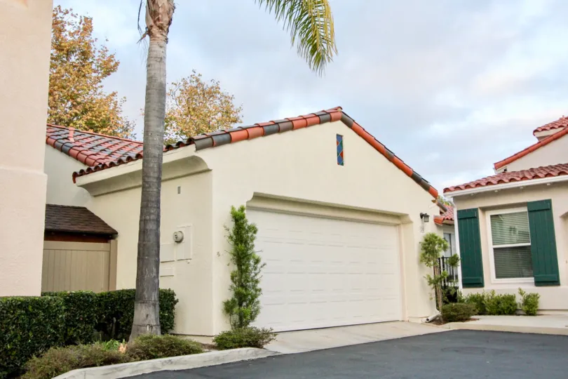 A cloudy day in the The Colony with in front of a garage.