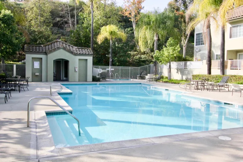 THE ESTATE IN THE The Villas WITH THE SWIMMING POOL, CHAIRS, TREES, PLANTS