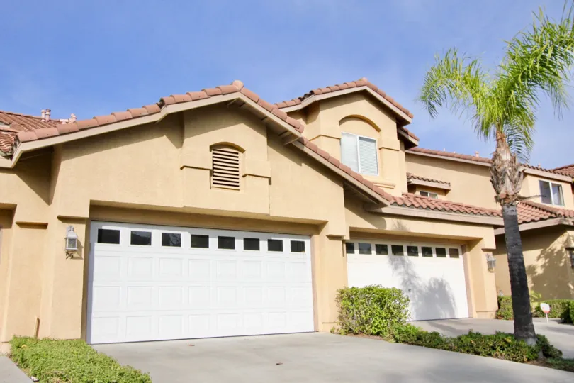 Two large garages, and multiple stories, grace this The Windwards community home.