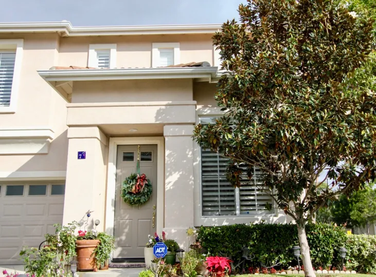A wreath hangs from the front door of this Tivoli II home