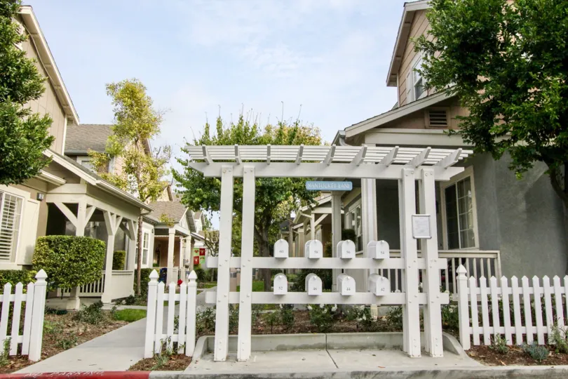 The mail station, surrounded by picturesque white picket fences, on Twelve Picket Lane.