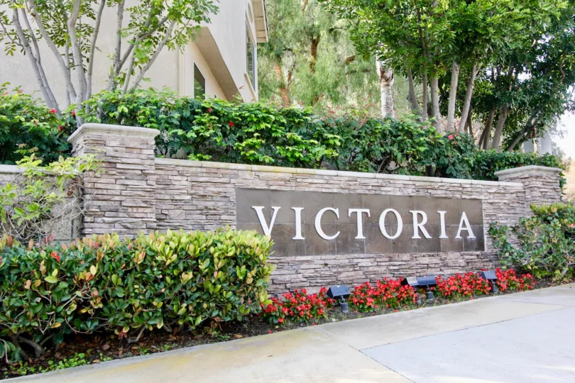 a warm day in the victoria with building that has wall on name victoria and gardens