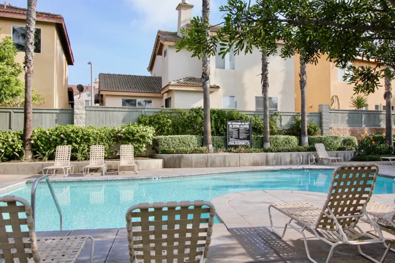 THE COTTAGE IN THE VILLAGE COTTAGES WITH THE SWIMMING POOL, CHAIRS, PLANTS, TREES