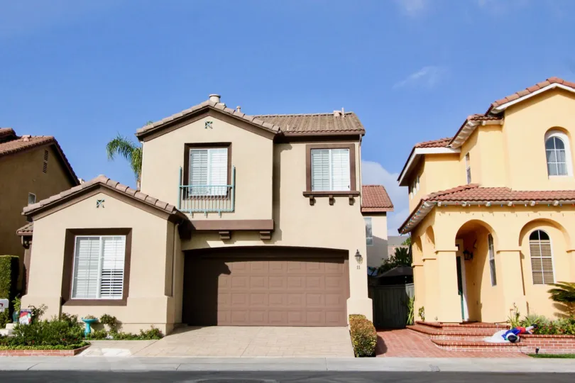Clear skies provide a lovely background to two unique homes in the Village Cottages community.