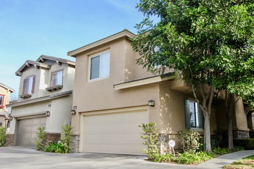 a warm day in the vista heights with building that has out gate in front of trees
