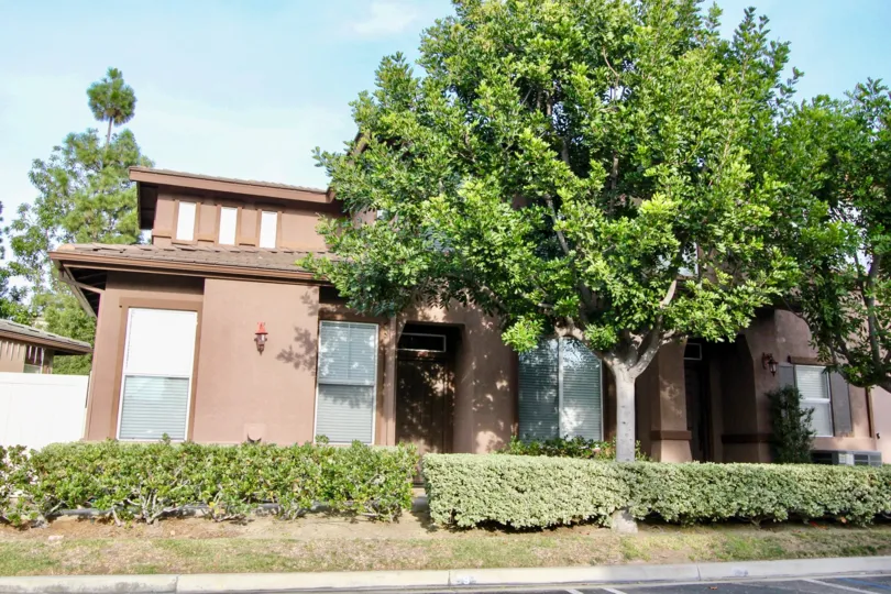 2 storey attached townhomes with ample yardspace and mature trees with shingle roofs at Vistas Above Wood Canyon