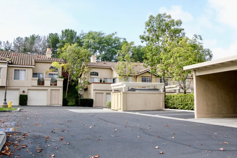 Sunny day view of parking area and townhouses in Windflower, Aliso Viejo, California