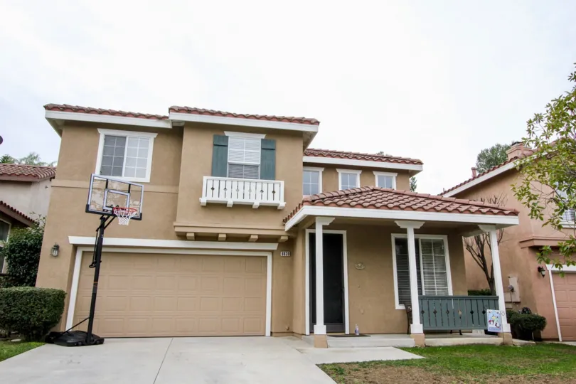 House in Cambria Community with Basketball Hoop with Tile roof and concrete driveway with single car garage