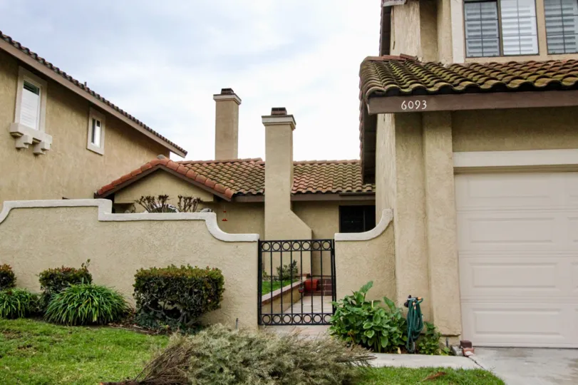 THE 6093 APARTMENT IN THE CAMINO GRANDE VILLAS WITH THE PLANTS, LAWN