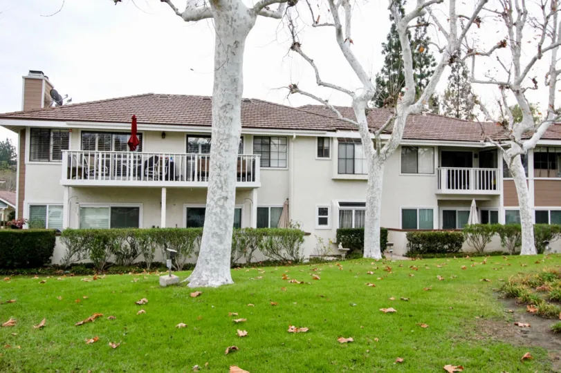 THIS APARTMENTS ARE SHOWN IN THE CITY OF ANAHEIM HILLS WHICH HAS THE BEAUTIFUL LAWN, PLANTS AND THE TREES
