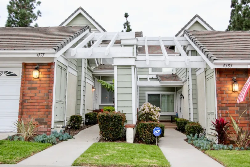 awesome decorated front view with plants and flowers in front of cool painted house in Canyon Terrace Townhomes