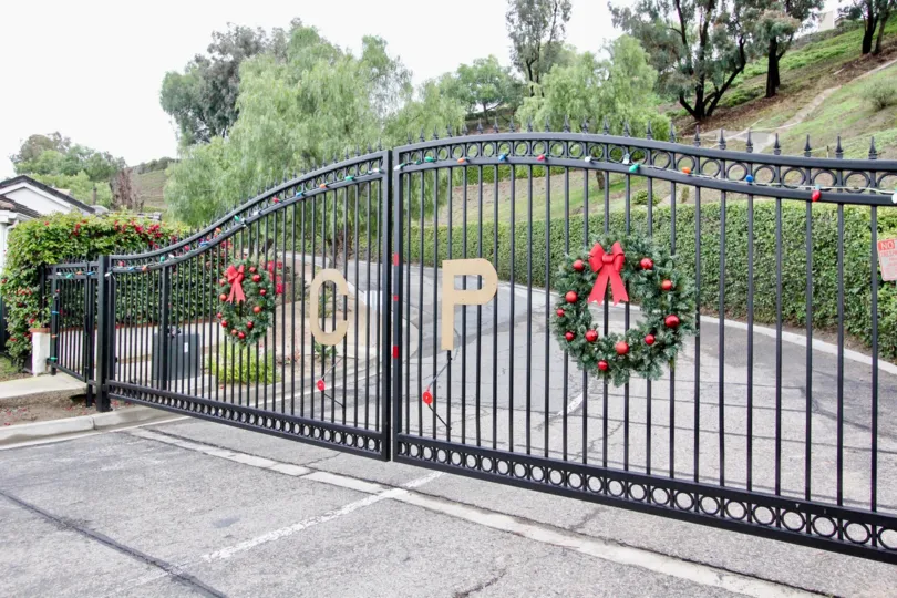 Decorated front entrance gate in front of the compound in Crown Pointe
