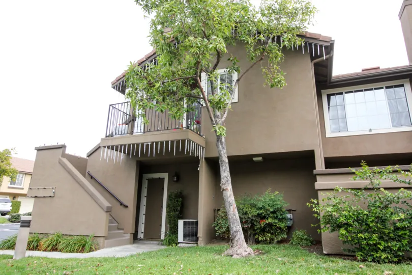 THE HOUSE WITH BEAUTIFUL LAWN, TREES, PLANTS WHICH IS SITUATED IN Laurelwood at Sycamore Canyon