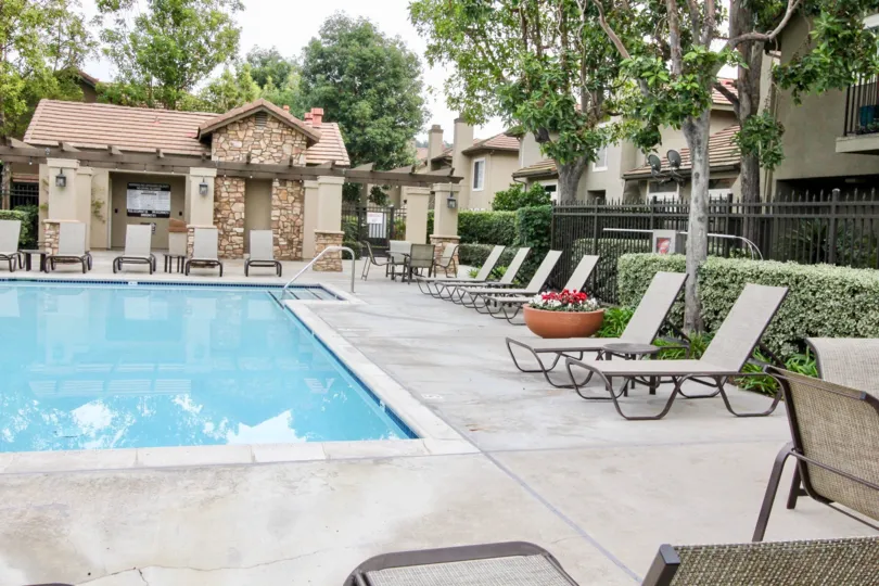 a pleasant day in the Laurelwood at Sycamore Canyon with a park that has swiming pool and furnitures and garden on back side