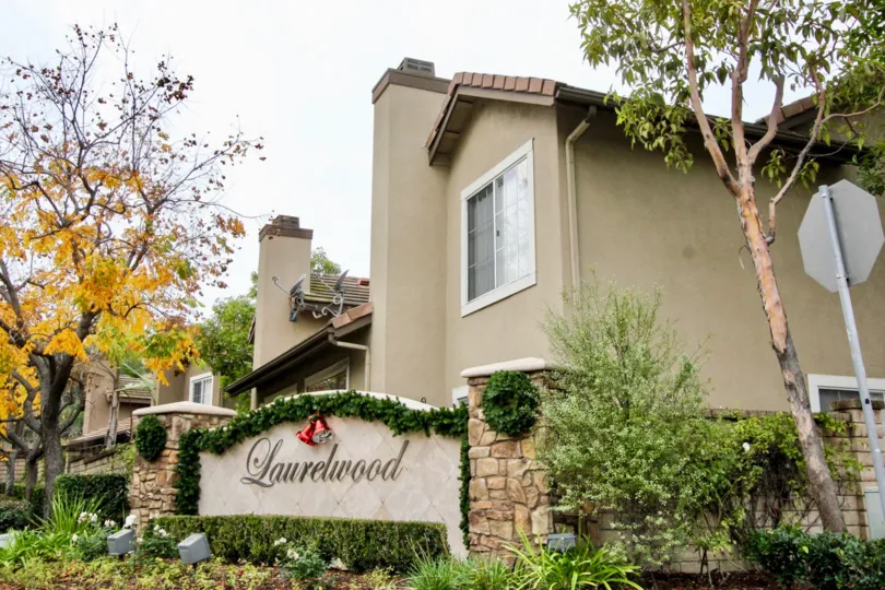 THE VILLAS IN THE Laurelwood at Sycamore Canyon WITH THE LAURELWOOD WALL, PLANTS, TREES