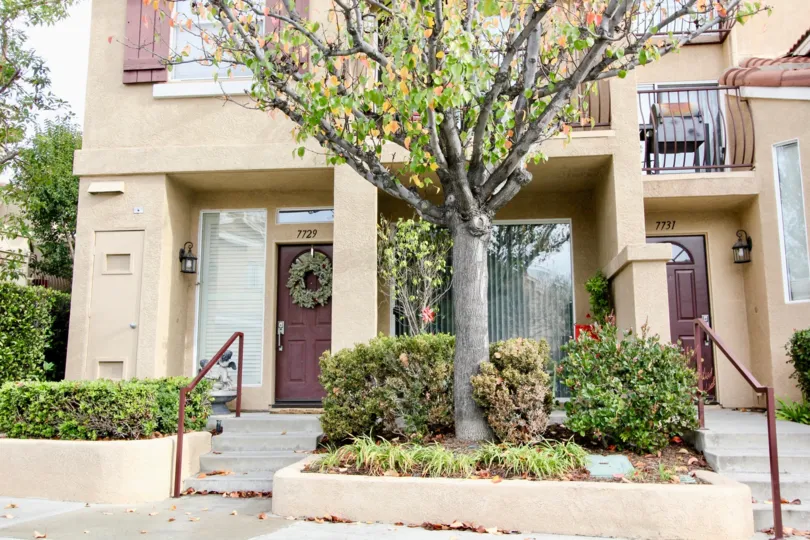 THE FRONT VIEW OF THE VILLAS WHICH IS IN ANAHEIM HILLS AND VIEWS THE DOOR NUMBER FOR EACH, LOT OF PLANTS, TREES ARE THERE