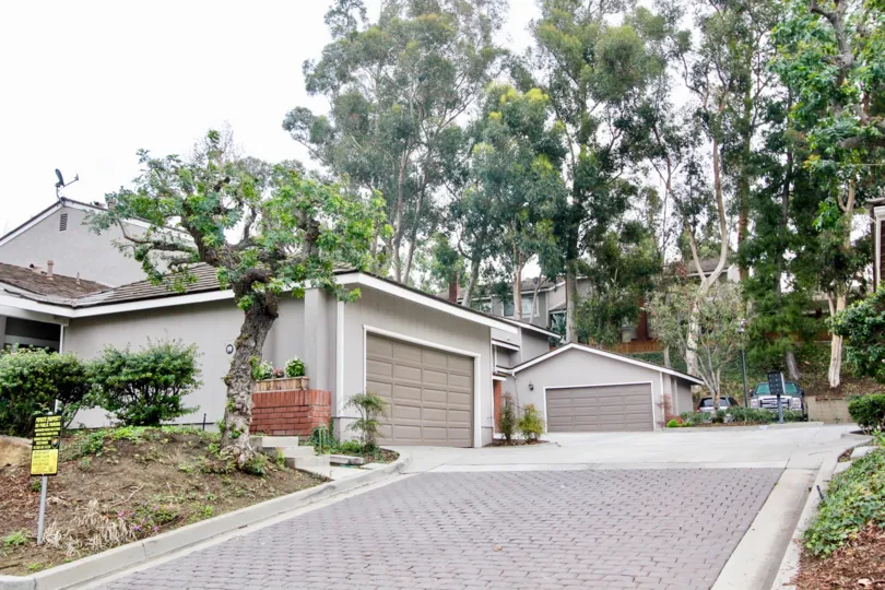 The Parkview Townhomes in the Anaheim Hills with a beautiful house and trees