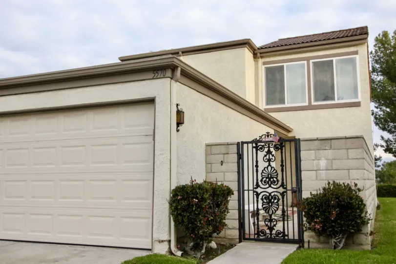 The cream color Rancho Yorba building with small front gate