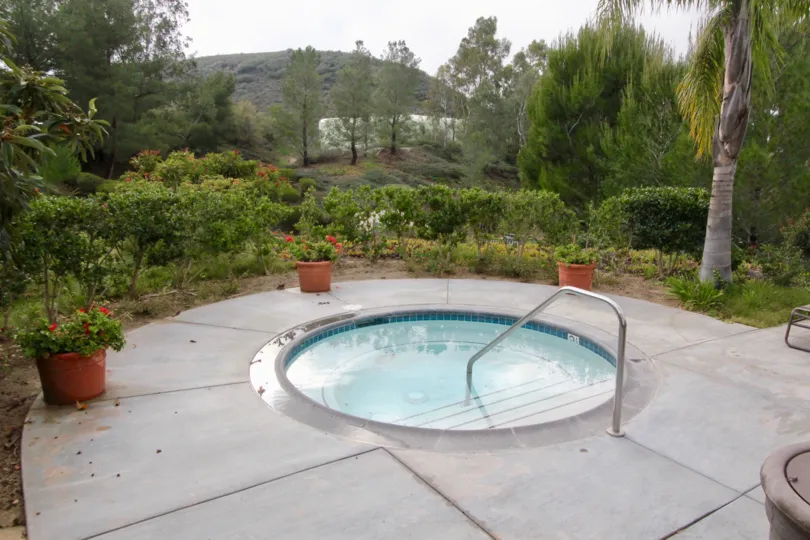 A cloudy day in the community of Viewpointe with a view of a swimming pool.